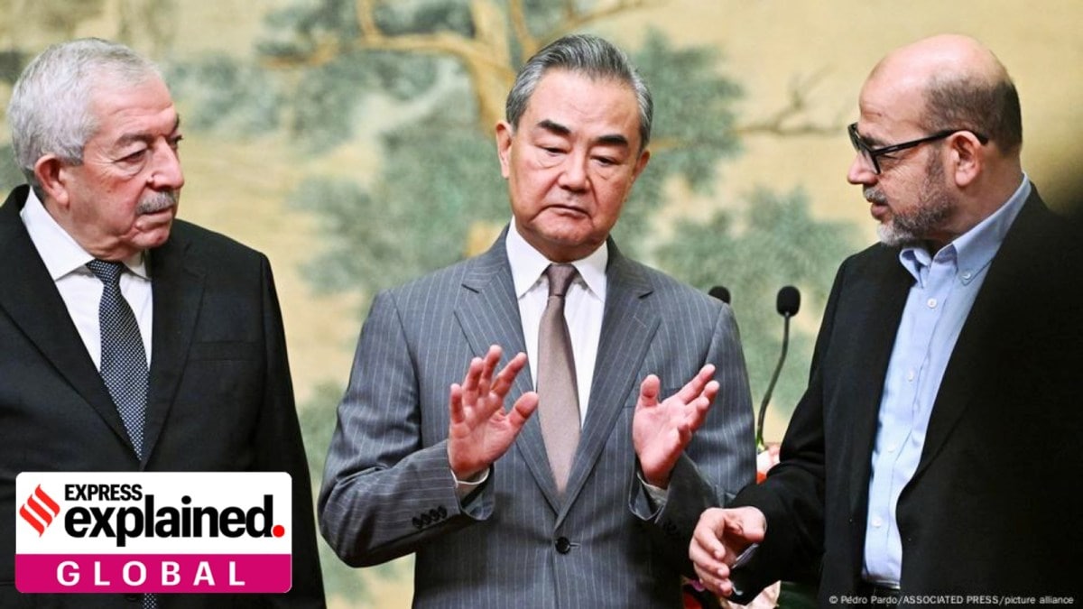 Vice Chairman of Fatah Mahmoud al-Aloul, left, Chinese Foreign Minister Wang Yi, and Senior Hamas member Mussa Abu Marzuk at the Diaoyutai State Guesthouse in Beijing, China.