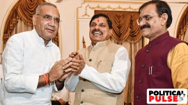 Madhya Pradesh Chief Minister Mohan Yadav (centre) greets five-time MLA from Vijaypur constituency, Ram Niwas Rawat (L) after he took oath as a Cabinet minister. (PTI)