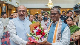 Newly-appointed Manipur Governor Lakshman Prasad Acharya being greeted by Chief Minister N. Biren Singh during his swearing-in-ceremony, at Raj Bhavan, in Imphal, Wednesday, July 31, 2024. (PTI Photo)