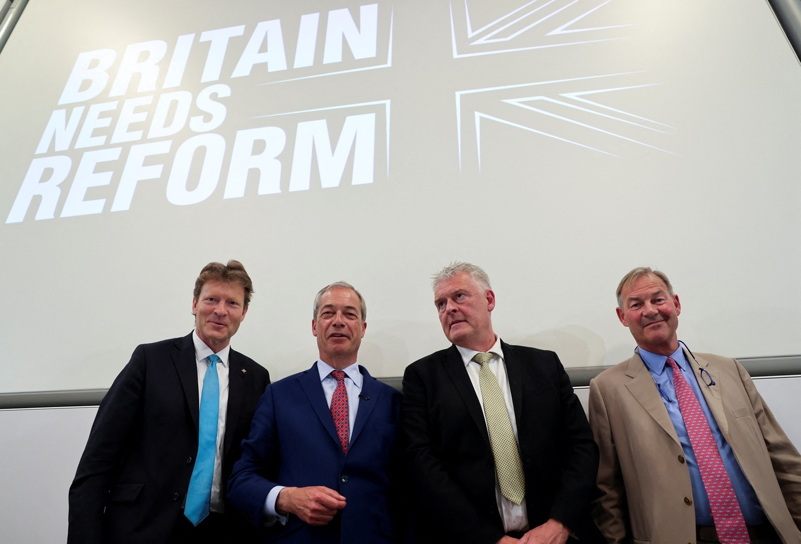 Britain's Reform UK Party Leader Nigel Farage poses with party Chairman Richard Tice and Reform lawmakers Lee Anderson and Rupert Lowe. (Reuters)