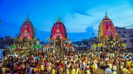 Devotees near the chariots during Rath Yatra festival, at Gundicha temple, in Puri