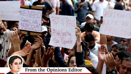 Students protesting after 3 UPSC aspirants passed away at a coaching centre in Delhi. (Express photo by Amit Mehra)