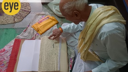 Genealogist Prabhu Lal from Kaithun village in Kotha district shows his pothi