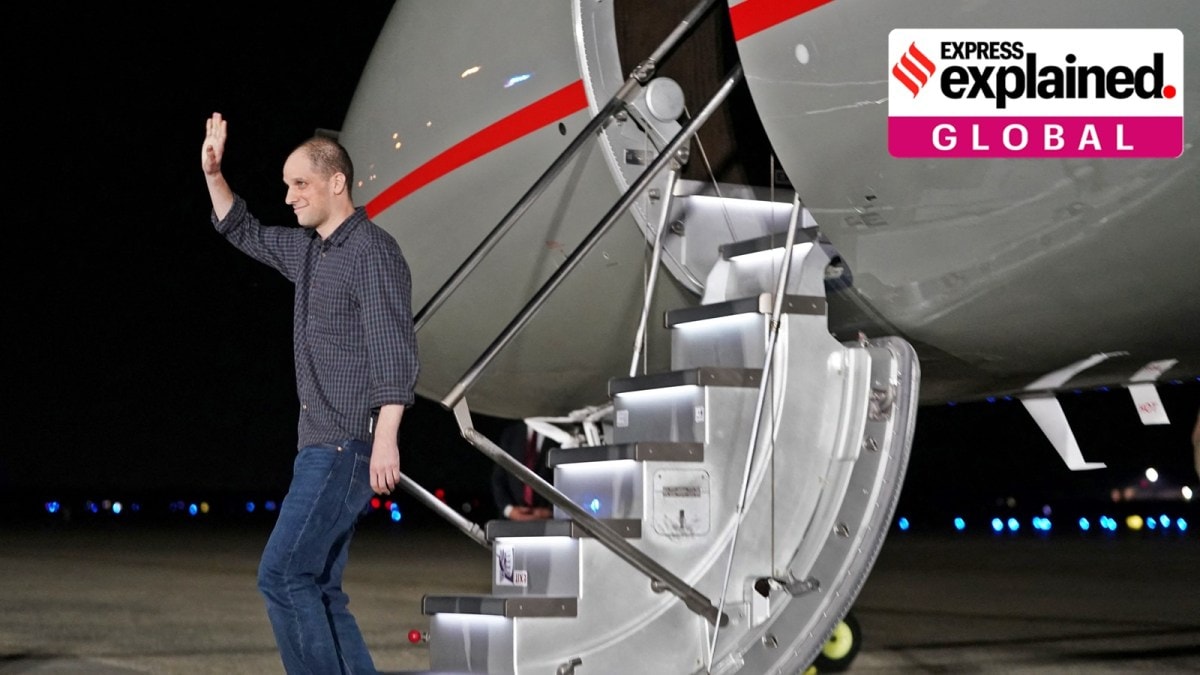 U.S. journalist Evan Gershkovic, who was released from detention in Russia, waves as he disembarks the aircraft upon his arrival at Joint Base Andrews in Maryland, U.S., August 1, 2024.