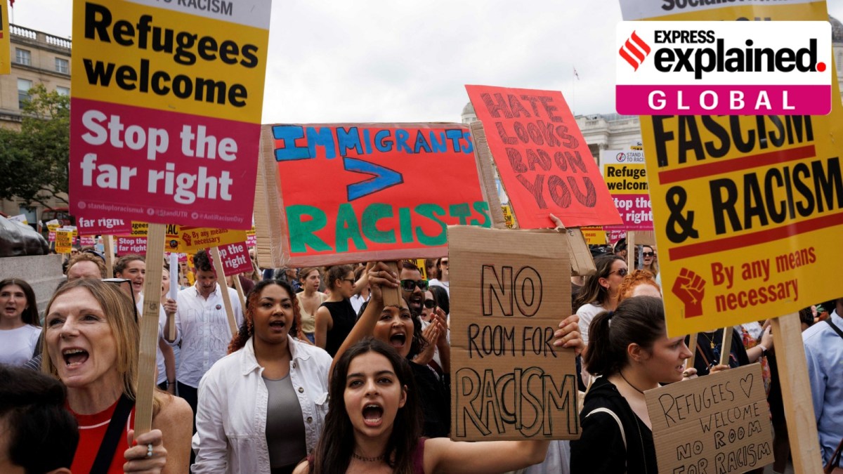 People hold signs at a protest against racism in Westminster, in London, Britain, August 10, 2024.