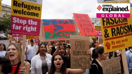 People hold signs at a protest against racism in Westminster, in London, Britain, August 10, 2024.