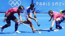 Indian hockey team's Abhishek takes on Spain's Jose Basterra (left) and Gerard Clapes during the men's bronze medal match at the Yves-du-Manoir Stadium during the Paris Olympics. (AP Photo)