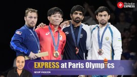 India's Aman Sehrawat shares the podium with other medallists during the Paris Olympics medal ceremony for men's freestyle 57kg weight class at Champ-de-Mars Arena. (AP Photo)