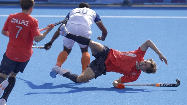 Amit Rohidas of India in action with William Calnan of Britain and Zach Wallace of Britain