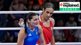 Algeria's Imane Khelif, red, next to Italy's Angela Carini, at the end of their women's 66kg preliminary boxing match at the 2024 Summer Olympics, Thursday, Aug. 1, 2024, in Paris, France.
