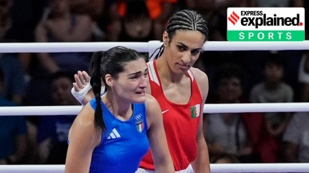 Algeria's Imane Khelif, red, next to Italy's Angela Carini, at the end of their women's 66kg preliminary boxing match at the 2024 Summer Olympics, Thursday, Aug. 1, 2024, in Paris, France.