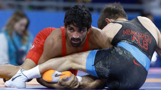 Aman Sehrawat of India in action with Zelimkhan Abakarov of Albania. (Reuters)