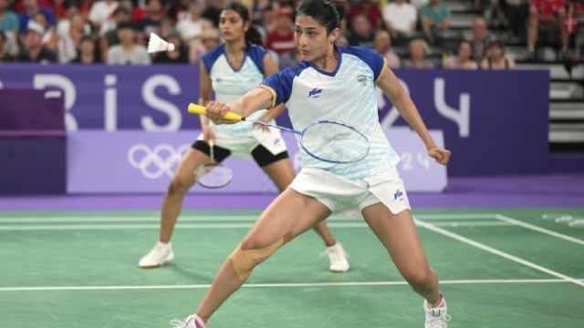 Ashwini Ponnappa play against Australia's Setyana Mapasa and Angela Yu during their women's doubles badminton group stage match at Porte de la Chapelle Arena during the 2024 Summer Olympics, Tuesday, July 30, 2024, in Paris, France. (AP Photo)