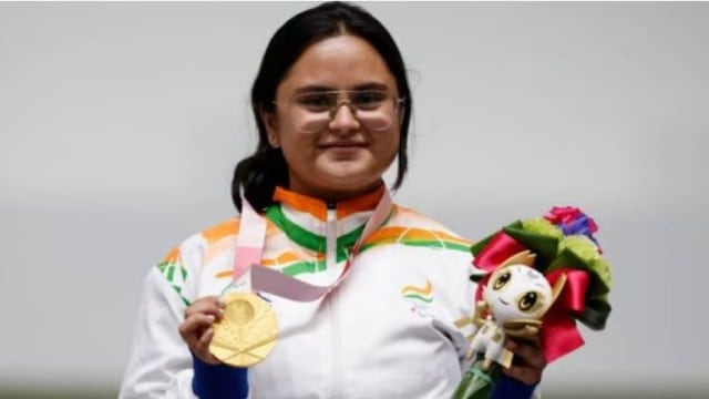 Gold Medallist Avani Lekhara of India celebrates on the podium at the Tokyo Games