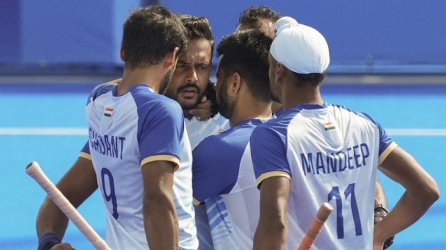 India's captain Harmanpreet Singh (C) celebrates a goal with others during the Hockey Men’s Quarterfinal match between India and Great Britain at the 2024 Summer Olympics, at Yves-du-Manoir Stadium, in Colombes, France