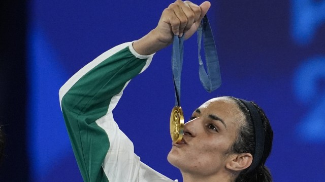 Gold medalist Algeria's Imane Khelif kisses her medal for the women's 66 kg final boxing match at the 2024 Summer Olympics