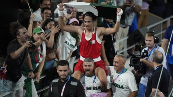 Algeria's Imane Khelif celebrates after defeating China's Yang Liu to win gold in their women's 66 kg final boxing match at the 2024 Summer Olympics