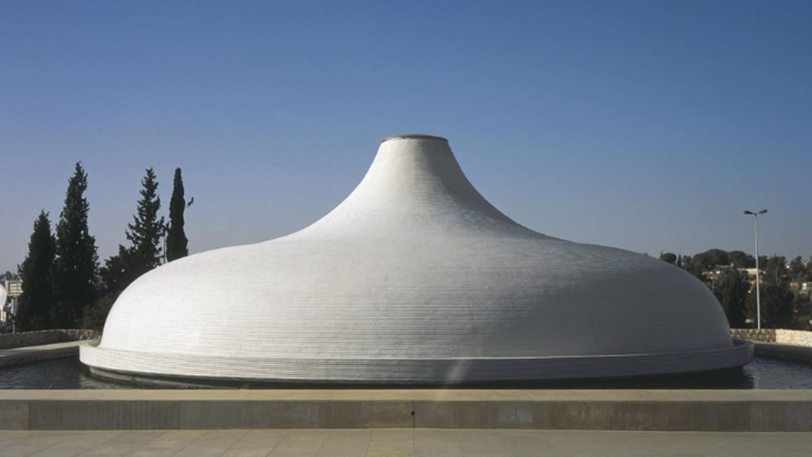 Why are museums in Israel avoiding mentioning their names alongside loaned works?