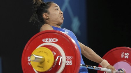 Mirabai Chanu Saikhom of India competes during the women's 49kg weightlifting event at the 2024 Summer Olympics, Wednesday, Aug. 7, 2024, in Paris, France. (AP Photo)