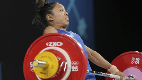 Mirabai Chanu Saikhom of India competes during the women's 49kg weightlifting event at the 2024 Summer Olympics, Wednesday, Aug. 7, 2024, in Paris, France. (AP Photo)