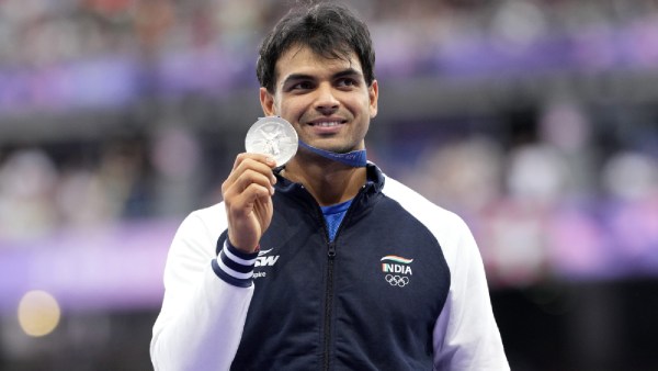 Men's javelin silver medalist, Neeraj Chopra, of India, stands on the podium at the 2024 Summer Olympics