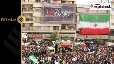 People gather as the coffins of Hamas late political leader Ismail Haniyeh and his bodyguard are carried on the back of a truck during a funeral procession in Tehran, Iran, 01 August 2024. Haniyeh and one of his bodyguards were targeted and killed in Tehran on 31 July 2024, the Iranian Revolutionary Guard Corps (IRGC) confirmed.