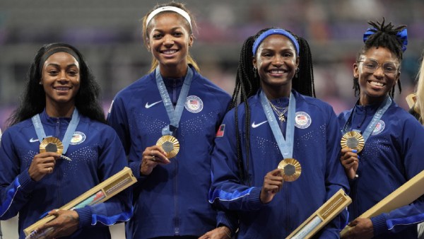 The United States' women 4x100-meter relay gold medalists, from left: Sha'carri Richardson, Gabrielle Thomas, Twanisha Terry and Melissa Jefferson, stand on the podium at the 2024 Summer Olympics, Friday, Aug. 9, 2024, in Saint-Denis, France. (AP Photo)