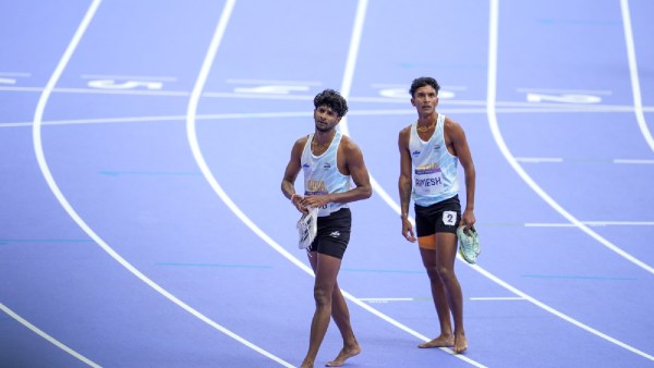India's Rajesh Ramesh and Amoj Jacob react after the men's 4 x 400m relay event at the 2024 Summer Olympics
