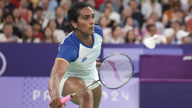 India's PV Sindhu plays against He Bing Jiao during their women's singles badminton lucifer  astatine  the Paris 2024 Olympics. (AP Photo)