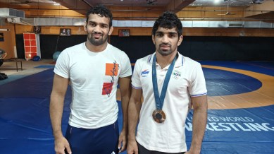 Aman Sehrawat (R) with his Chhatrasal roommate and senior wrestler at the basement-training facility of the akhada. Credit: Express Photo