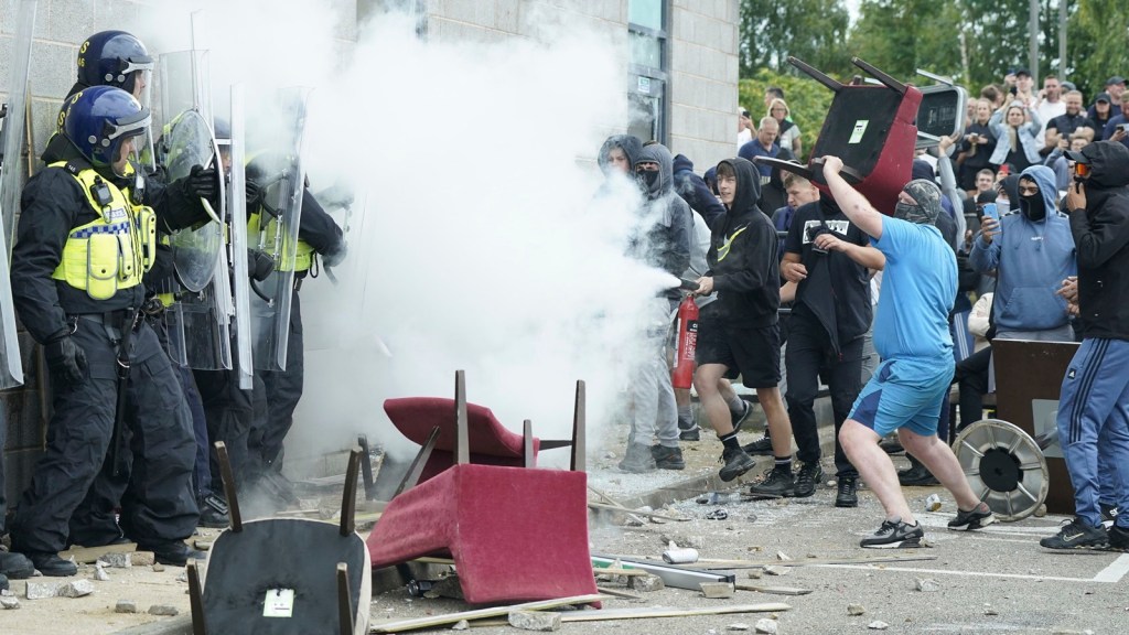 UK riots halted by police, communities but country remains on alert