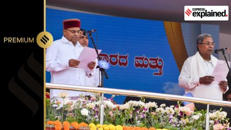Karnataka Chief Minister Siddaramaiah (right) is administered the oath of office by Governor Thawarchand Gehlot in Bengaluru in 2023.