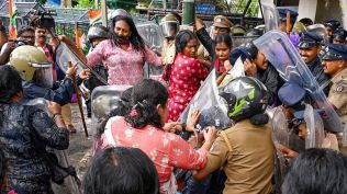 Mahila Congress workers scuffle with police personnel during a protest against actors Mukesh and Siddique, accused of sexual assault, in Kochi hema