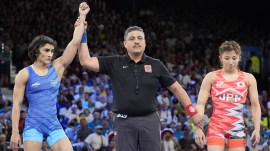 Vinesh Phogat India's Vinesh Phogat, left, celebrates after defeating Japan's Yui Susaki in the round of 16 of the women's freestyle 50kg wrestling match, at Champ-de-Mars Arena, during the 2024 Summer Olympics