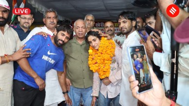 Vinesh Phogat India Arrival Live: Vinesh Phogat received a grand welcome on her return to the country with hundreds of supporters gathering outside the IGI airport. (Express Photo by Gajendra Yadav)