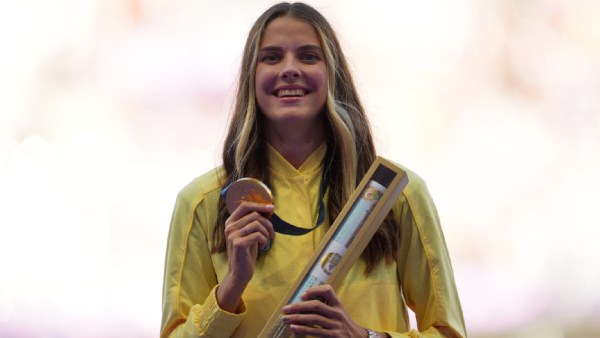 Gold medallist Yaroslava Mahuchikh of Ukraine celebrates on the podium with her medal