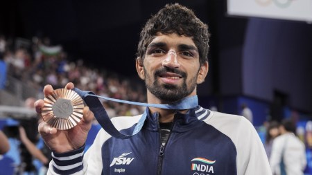 Bronze medalist India’s Aman Sehrawat poses for photos during the victory ceremony for the men's 57kg free-style wrestling event at the 2024 Summer Olympics, in Paris, France