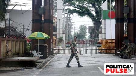 A BSF officer patrols the Petrapole-Benapole Border between India and Bangladesh. (PTI)