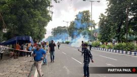 Kolkata police uses tear gas to to disperse protesters enroute Bengal secretariat. (Express Photo by Partha Paul)