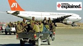 Taliban militia in front of the hijacked Indian Airlines IC-814 flight at Kandahar airport in December 1999.
