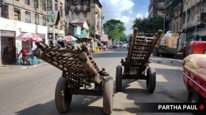 In Kolkata, roads looked less busy with fewer buses, auto-rickshaws, and taxis on roads than on normal weekdays. (Express Photo by Partha Paul)