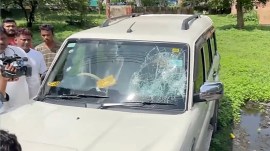 A social media video purportedly showed bullets being fired at Pandey’s car while he was inside it. (Screengrab/ANI)