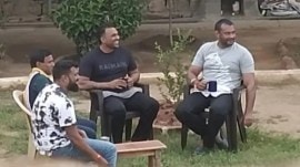 In the viral photo, Darshan Thoogudeepa, who is in jail in connection with the murder of Chitradurga resident Renukaswamy, Wilson Garden Naga, and others can be seen sitting on a lawn of the prison and smoking a cigarette with gangster J Nagaraj. (Express Photo)