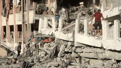 Palestinians inspect the site of Israeli strikes on a school sheltering displaced people, amid Israel-Hamas conflict, in Gaza City, August 3, 2024. (Reuters)