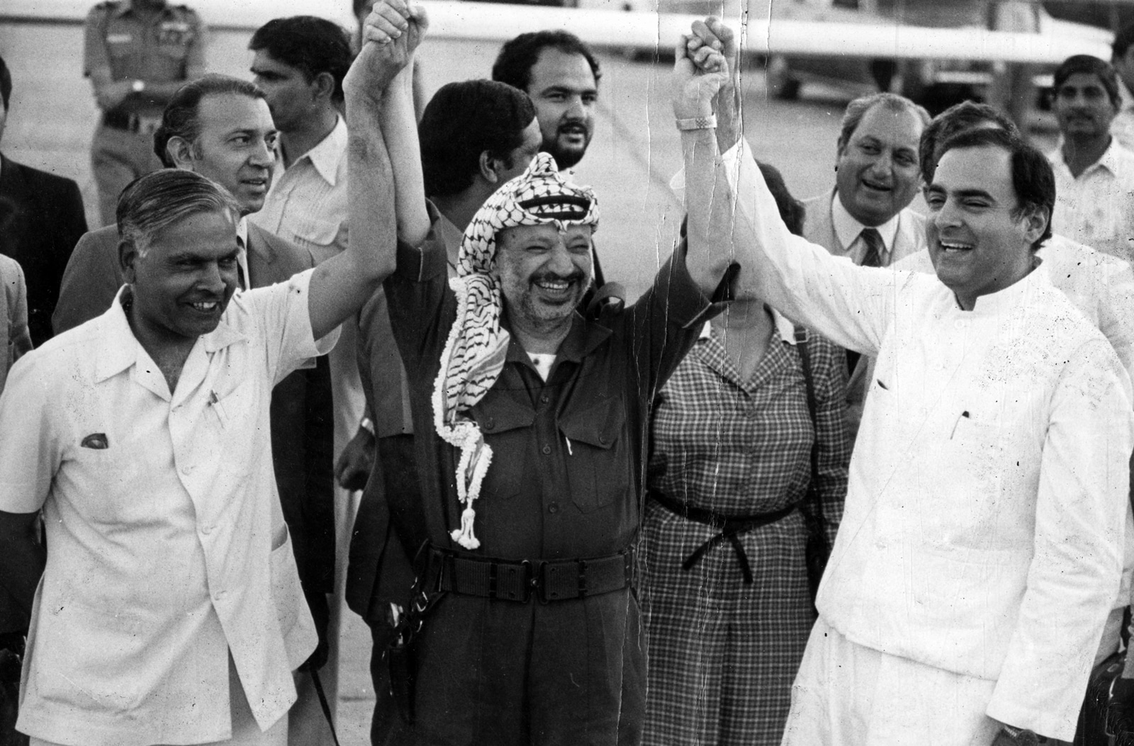 Former PM Rajiv Gandhi with then-Minister of State for Steel Natwar Singh with the chairman of the Palestinian Liberation Organisation, Yasser Arafat at the Delhi airport on April 18, 1985. (Express archive) 