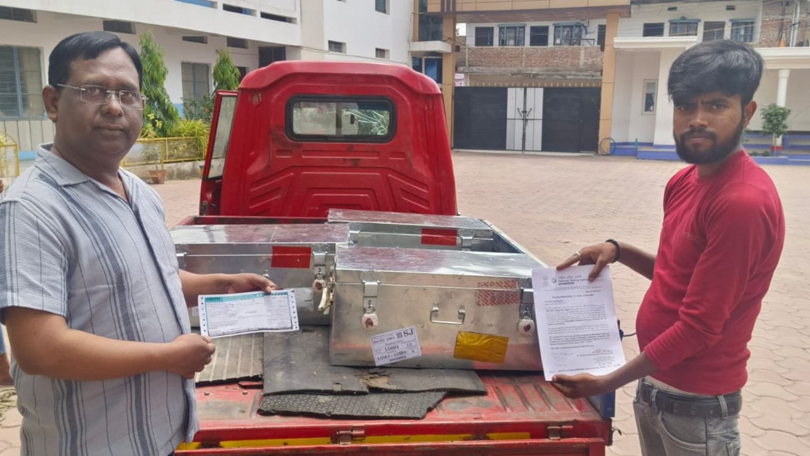 Oasis School principal Ehsanul Haque handing over OMR sheets to a private courier company on May 5. (Photo credit: Express photo)