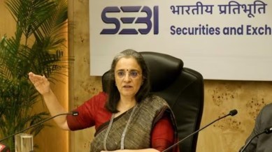 SEBI Chairperson Madhabi Puri Buch, Sebi probe, SEBI Chairperson controversy, Dhaval Buch, Adani group fund flows, Hindenburg, Indian express news
