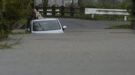 A car is submerged at a flooded area due to heavy rains from Typhoon Shanshan in Yufu, Oita Prefecture, southwestern Japan, August 29, 2024 REUTERS PHOTO