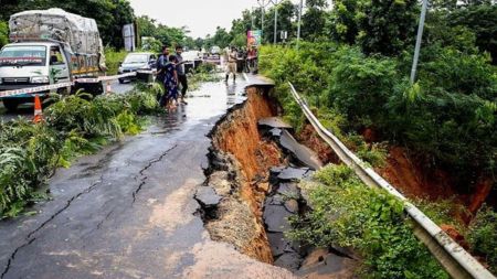 A portion of a road got damaged due to heavy rainfall, on the outskirts of Agartala, Wednesday, Aug. 21, 2024. (PTI Photo)