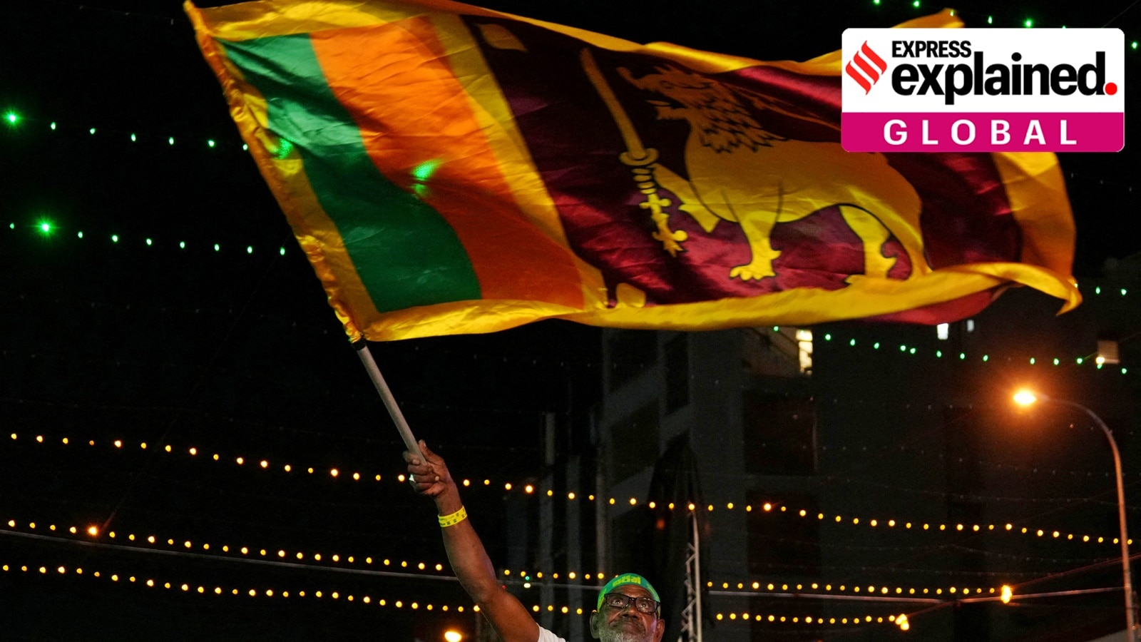 A supporter waves Sri Lanka's national flag during an election campaign rally ahead of the presidential election, in Colombo, Sri Lanka, on September 18, 2024.